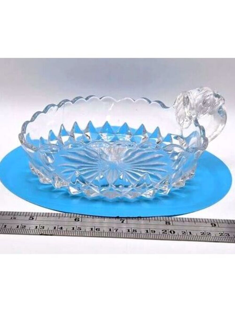 Vintage Pressed Glass Nappy Dish with Elephant Head Handle and Sawtooth Edge
